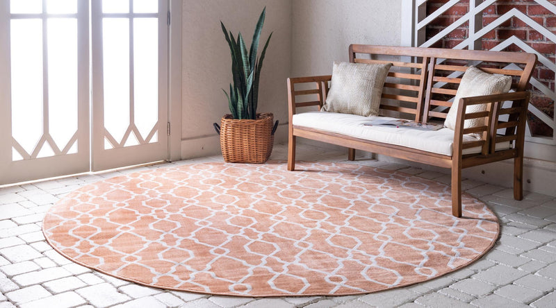 Patio Paradise Collection Area Rug - Lagoon Round Peach lifestyle 55