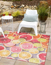 Belizean Tropics Outdoor Rugs Collection Area Rug -  Savanna Square Rust Red and Yellow  lifestyle 23